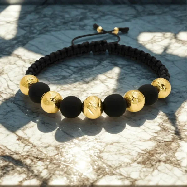 Manilla tejida balines en oro laminado 18k y neopreno 8mm