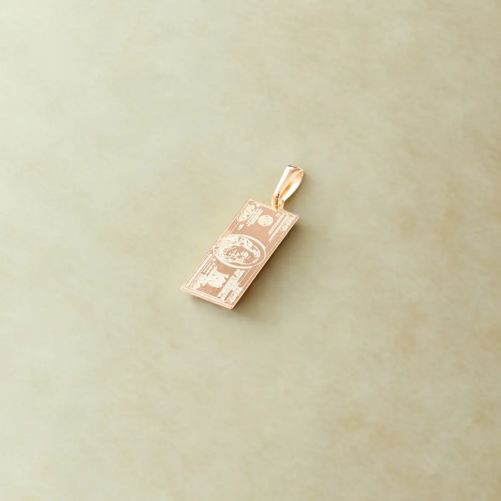 dije dolar en oro laminado, fondo gris