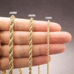 Vale La Pena Comprar oro laminado, mano con cadenas