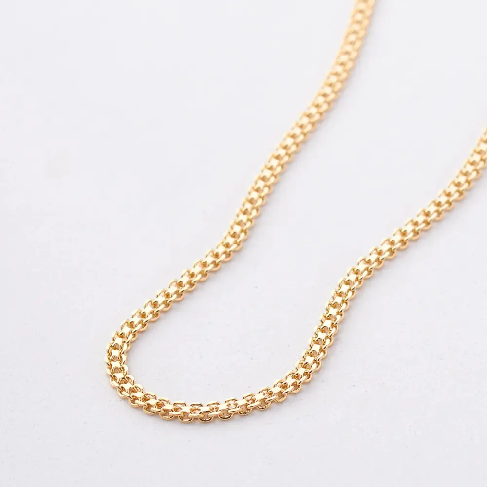 cadena china oro laminado en fondo beigs